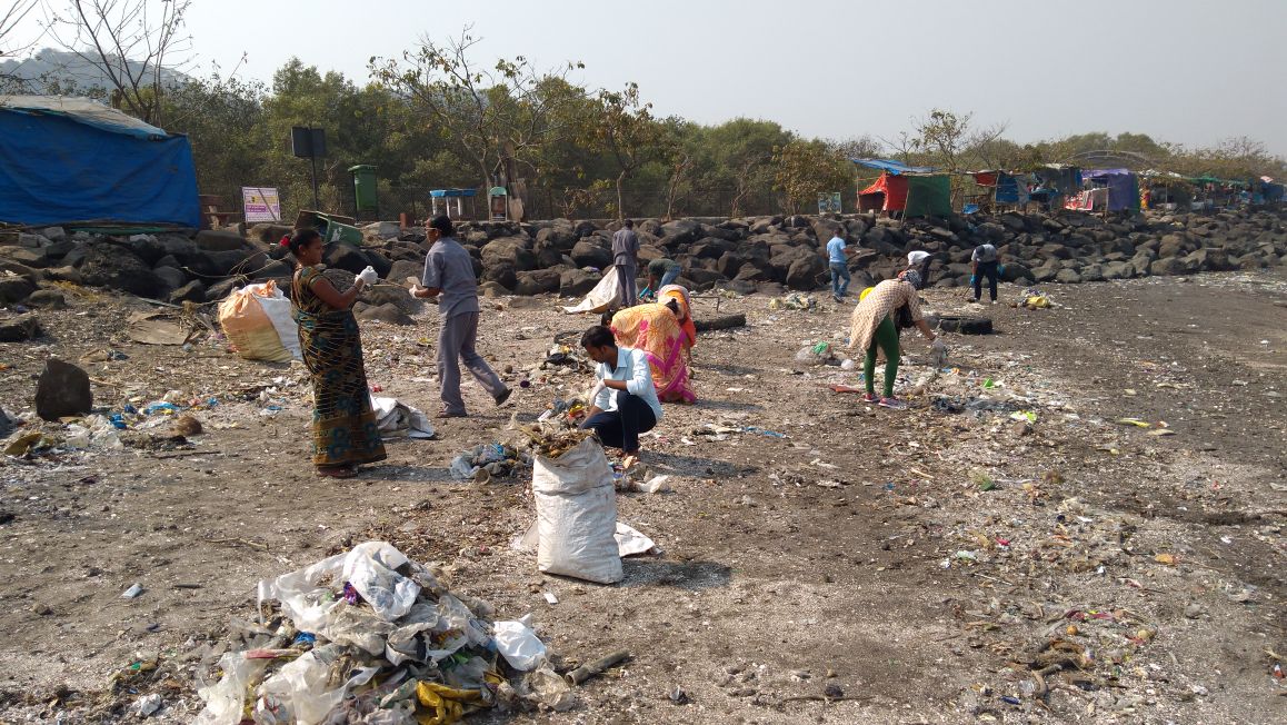Elephanta Island beach with visible waste and pollution challenges